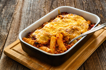 Rigatoni con ragù alla bolognese casserole - roasted noodles with bolognese sauce and mozzarella...