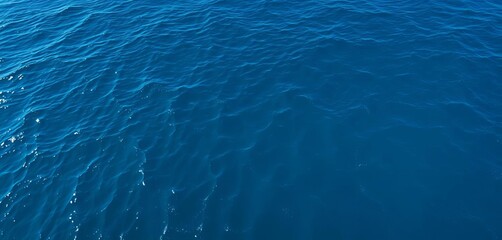 Obraz premium Vast expanse of deep blue ocean, tranquil waves, peaceful, tranquil