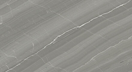 A close up of a gray marble slab with white veins running through it diagonally across the surface