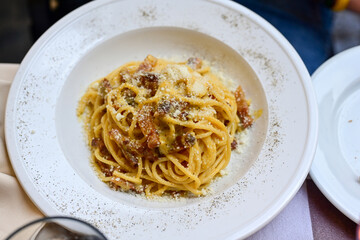 Fresh pasta   spaghetti  carbonara and Aperol Spritz  at  typical italian resaturant at Trastevere   neighbourhood at Rome 
