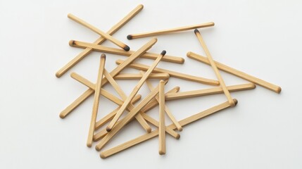 Used matches scattered on a white surface