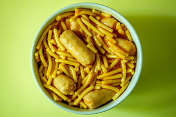A Bowl of Classic Spaghetti in Tomato Sauce With Pork Sausages