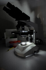 Close-up of a microscope in a laboratory, used for detailed scientific analysis.