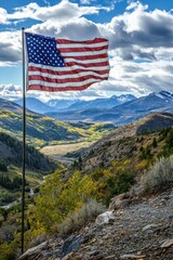 Majestic American Flag Flying High Over Scenic Mountain Valley Under a Cloudy Sky