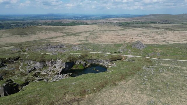 Foggintor, Dartmoor, Devon, England: DRONE VIEWS: The former granite quarry, Foggintor, surrounded by Dartmoor. Foggintor provided granite for the construction of Nelson's Column column (Clip 23).