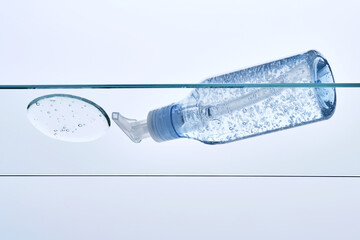 Micellar gel for cleansing the skin from makeup on a glass shelf.