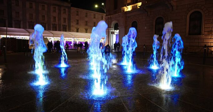  Nightscapes - Illuminated fountain in Lecco Italy.