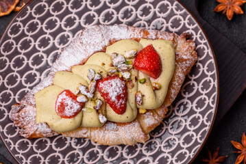 Food for breakfast sweet strawberry croissants with chocolate filling