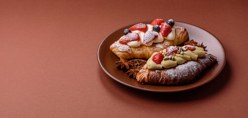 Food for breakfast sweet strawberry croissants with chocolate filling