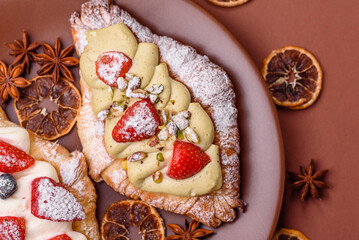 Food for breakfast sweet strawberry croissants with chocolate filling