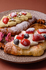 Food for breakfast sweet strawberry croissants with chocolate filling