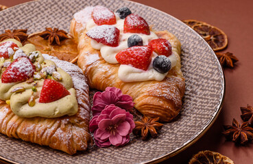 Food for breakfast sweet strawberry croissants with chocolate filling