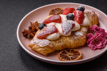 Food for breakfast sweet strawberry croissants with chocolate filling