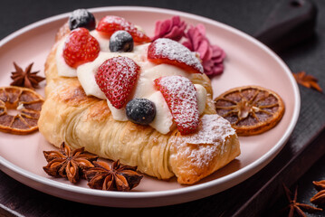 Food for breakfast sweet strawberry croissants with chocolate filling