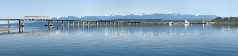 Wide panorama of Hood Canal Floating Bridge and Olympic Mountains