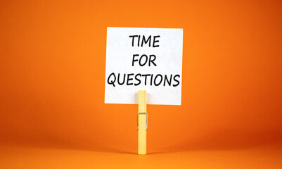 Time for questions symbol. Concept words Time for questions on beautiful white paper on clothespin. Beautiful orange background. Business time for questions concept. Copy space.