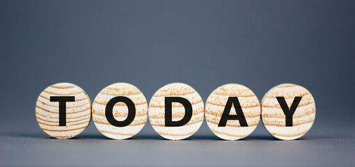 Today symbol. Concept word Today on beautiful wooden circles. Beautiful grey table grey background....