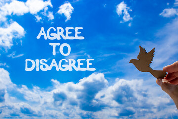 Agree to disagree symbol. Concept words Agree to disagree. Beautiful blue sky clouds background....