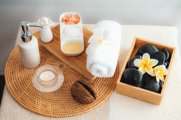 Exquisite display of beauty treatment and spa salon accessories arranged on spa table in luxury spa resort. Relaxing spa massage and recreation background concept. Quiescent
