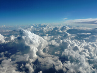 aerial view of the outside, filled with clouds above the sky