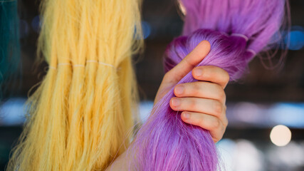 Close-Up Hand Touch of Natural colorful silk threads and dyeing with raw materials, traditional...