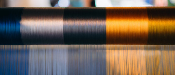 Silk thread from weaving machine traditional craft, a vibrant tapestry of color.