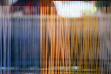 Silk thread from weaving machine traditional craft, a vibrant tapestry of color.