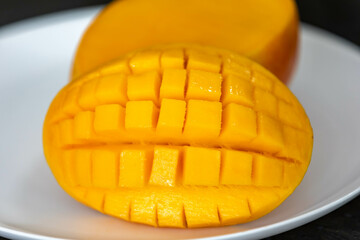 Ripe rosa mango isolated on uniform background. Brazilian fruit and food