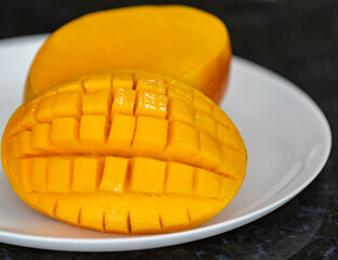 Ripe rosa mango isolated on uniform background. Brazilian fruit and food