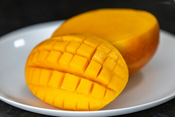 Ripe rosa mango isolated on uniform background. Brazilian fruit and food