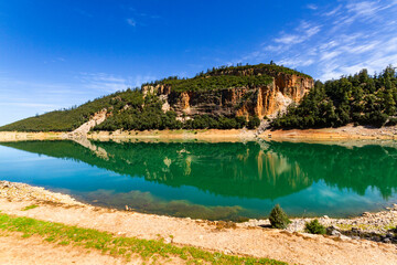 The beautiful crystal clear Aguelmame Sidi Ali Lake. Khenifra National Park, Middle Atlas...