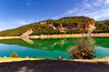 The beautiful crystal clear Aguelmame Sidi Ali Lake. Khenifra National Park, Middle Atlas Mountains, Morocco