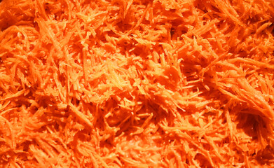 Grated carrot texture. Food ingredient top view. Healthy eating