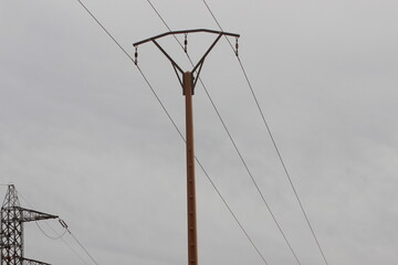 A view of a power electric pole with wires