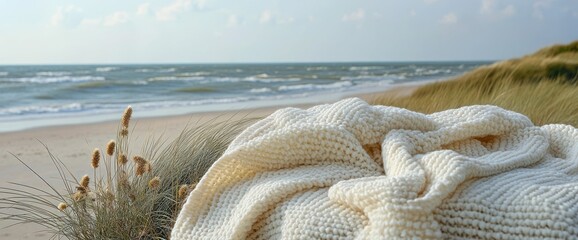 Knitted throw on the beach