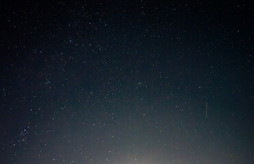 Perseids, A meteor shower in August from the constellation Perseus.The night starry sky.Photo of...