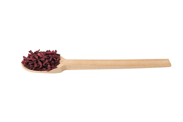 Dried beetroot slices on wooden spoon isolated on white background.