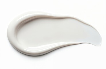White cream smear isolated on white. of fluid cosmetic product, foundation, concealer, or hand cream. Top view. Mockup of skincare beauty product, sample texture.