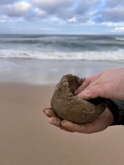 Pottery hands on the beach