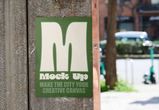 Empty din A4 paper mockup affixed to a textured urban wall.