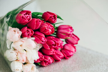 Fresh bouquet of pink and white tulips arranged elegantly for special occasions