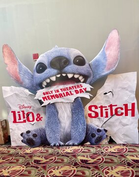 Kent, WA - USA - May 6, 2025 - Stand-up promotional display for the movie - Lilo & Stitch  is displayed inside a movie theater.