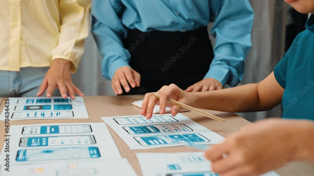 Poster Panorama video of startup UX developer or company employee design user interface or UI prototype for mobile application or website software with software display on smartphone in office. Synergic