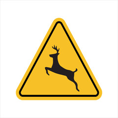 wild animal crossing warning sign with deer silhouette inside yellow triangle indicating wildlife caution