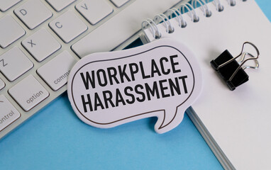 A white keyboard with a black clip on it