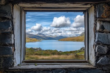 Stunning Perspective of Snowdon Peaks Framed by the Rustic Window of an Abandoned Miners Cabin in North Wales