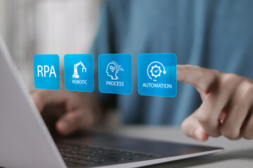 RPA, Robotic process automation concept. Digital transformation and change management, Business automation with AI. Person use laptop with RPA icons on virtual screen.