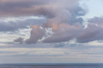 A Tranquil Ocean Scene with Vibrant Clouds in Kailua-Kona, Hawaii