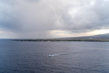Coastal View with Boat Under Cloudy Sky Near Kailua-Kona, Hawaii Horizon