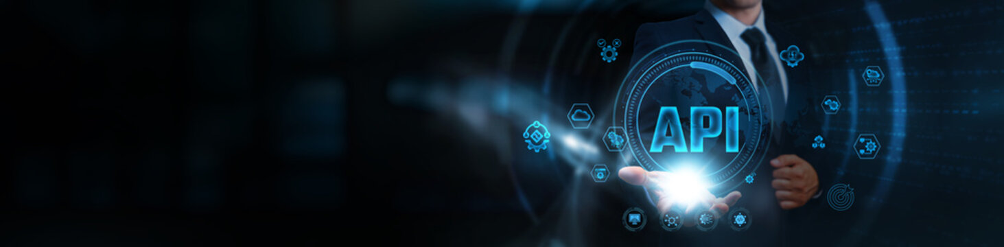API: Businessman holding the interface of application programming, business and interconnected network. Data exchange, system integration, real-time communication, and software interoperability.